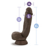 Chocolate skin tone ultra realistic dildo. Featuring a defined rounded head, subtle veins along the straight but flexible shaft, and realistic balls. Suction cup base. Additional images show alternate angles.