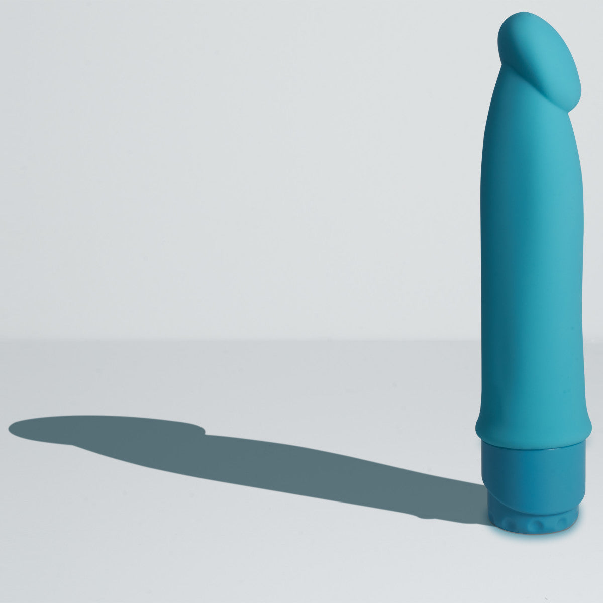 Blue vibrating dildo. Semi realistic shape with defined head and smooth straight shaft. Twist dial on bottom to control intensity. Additional images show alternate angles.