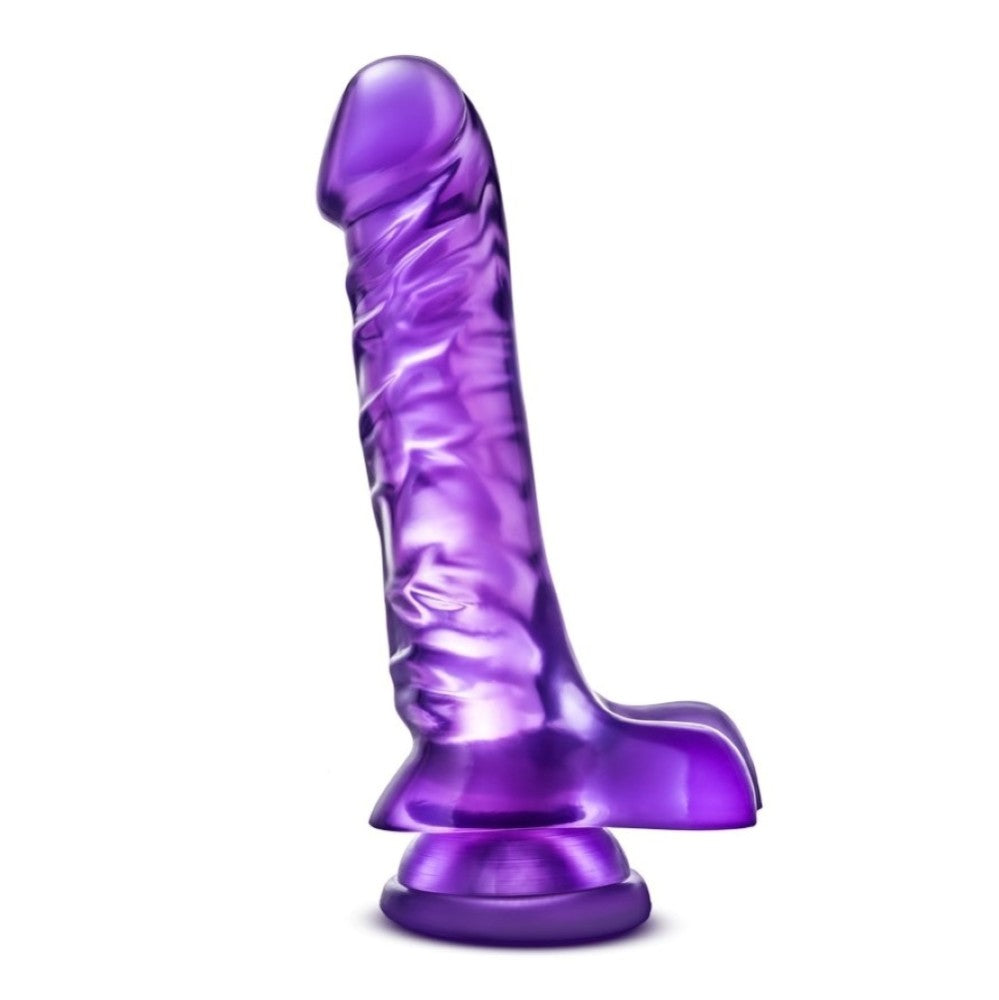 Translucent purple realistic dildo. Featuring a realistic head. Veins along the straight but flexible shaft. Realistic balls. Suction cup base. Additional images show alternate angles.