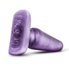A classic shaped medium purple butt plug with a subtle swirl color pattern. This plug features a tapered tip, slim neck, and flared base. Additional images show alternate angles.