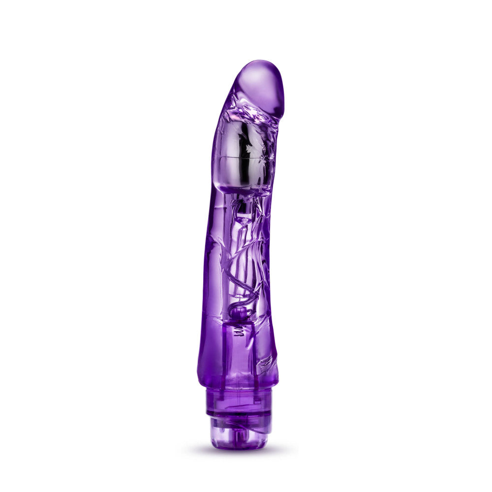 Translucent purple vibrating dildo has a realistic shape with a subtle rounded head and veins along the shaft. Silver bullet motor just below the head. Twist dial on bottom to adjust intensity. Additional images show alternate angles.