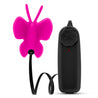 A small egg shaped bullet with a soft, fuchsia silicone cover in the shape of a butterfly for a fluttering sensation. Bullet is connected to a black plastic controller by a black flat cable. Twist dial on controller to adjust intensity. Additional images show alternate angles.